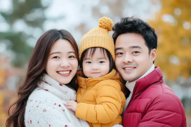 vecteezy_happy-family-embracing-in-autumn-park-warm-smiles-and_57671572