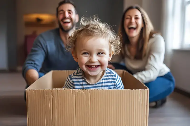 vecteezy_happy-family-playing-with-child-in-cardboard-box_63128185